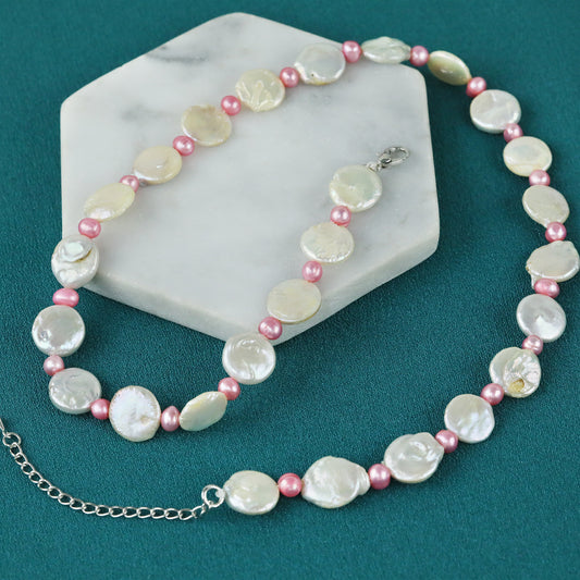 White button-shaped freshwater pearl necklace with pink freshwater pearl spacers.